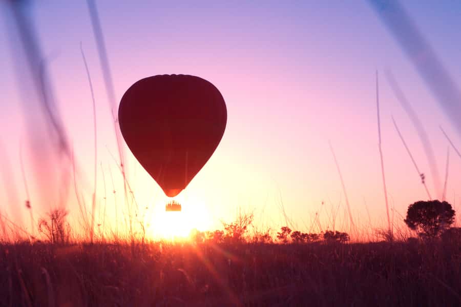 Alice Springs: Early Morning Hot Air Balloon Flight - Landing gently, then getting your hands dirty