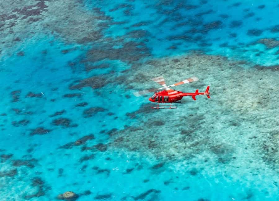 Cairns: Great Barrier Reef 30-Minute Helicopter Flight - Green Island and the changing colors below