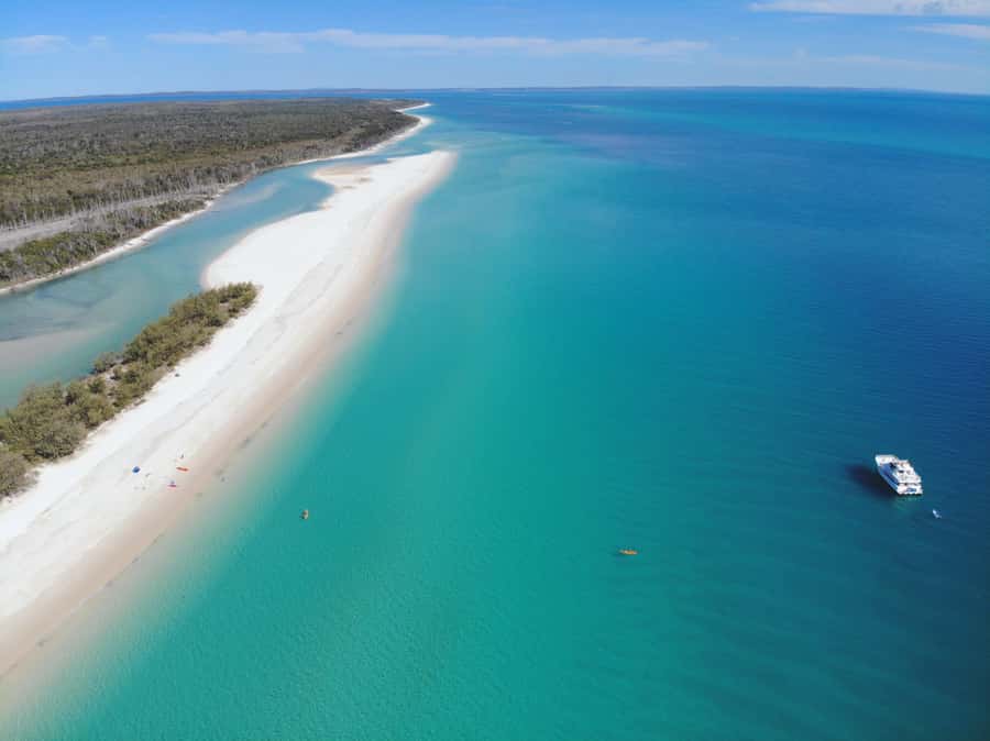 From Hervey Bay: Half-Day K'gari Fraser Island Beach Cruise - Crossing the clear waters toward K’gari
