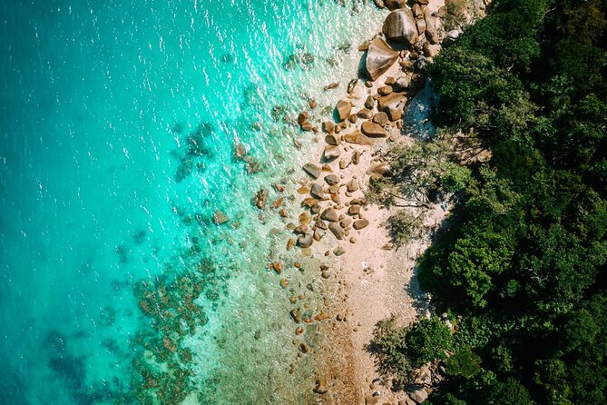Full-Day Great Barrier Reef Sailing Trip from Cairns - Equipment, exposure suits, and age rules