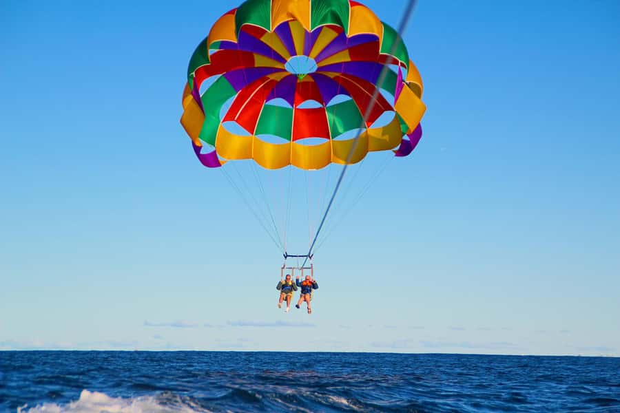 Gold Coast: Surfers Parasailing with Free Photos - Staying dry, or taking a quick splash