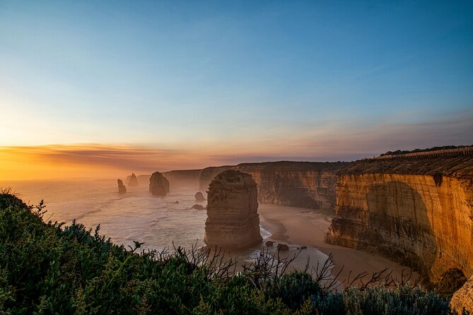 Great Ocean Road 12 Apostles & Rainforest Walk with Morning Tea - The Memorial Arch explains the road’s human story