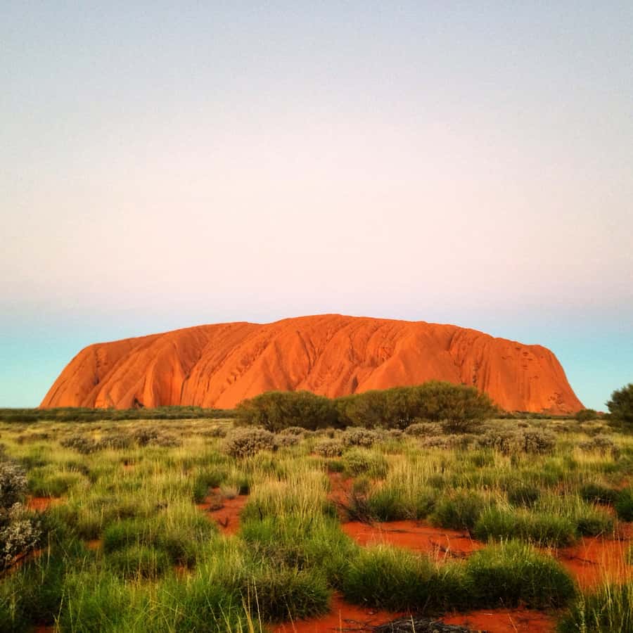 Uluru: Small Group Guided Tour with Sunset Refreshments - The first look at Uluru from the desert