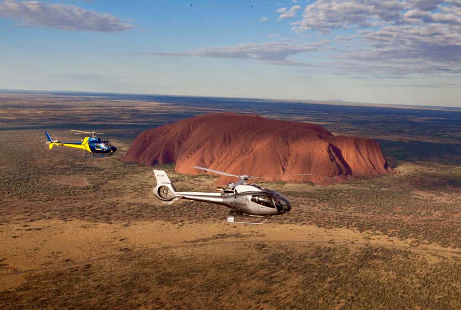 Yulara: Uluru and Kata Tjuta Sunset Helicopter Tour - At Ayers Rock Airport, expect a careful briefing
